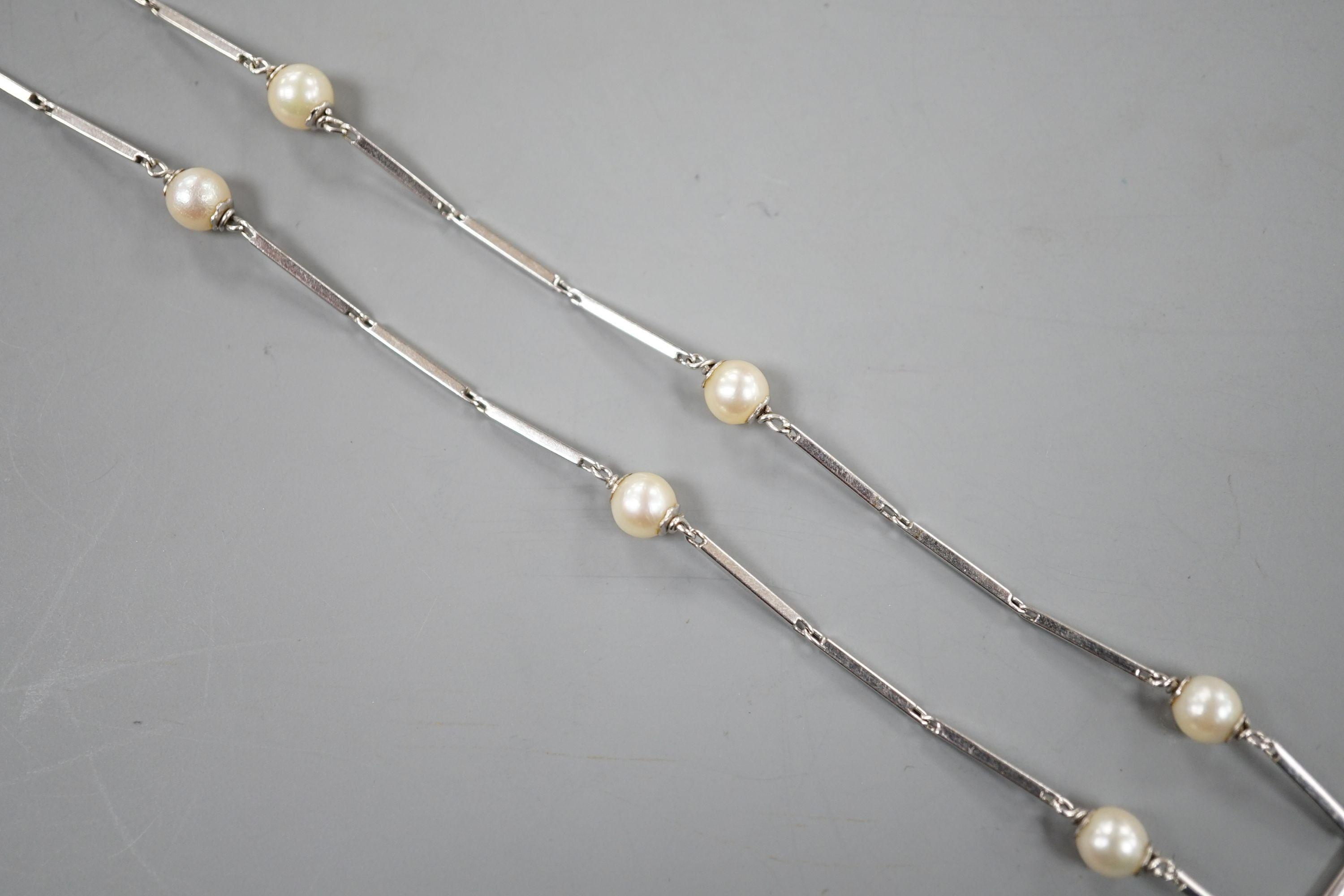 A modern Italian 750 white metal baton link and cultured pearl set necklace, 58cm, gross weight 12.7 grams.